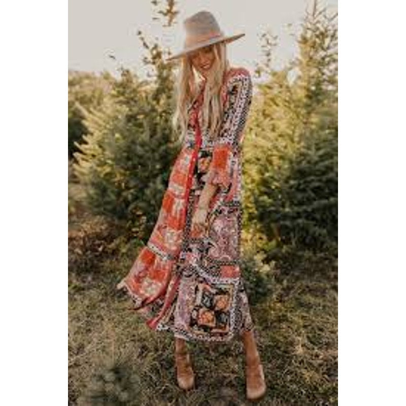 This is a bohemian-style floral geometric orange and tan button-down shirt dress or long cardigan
