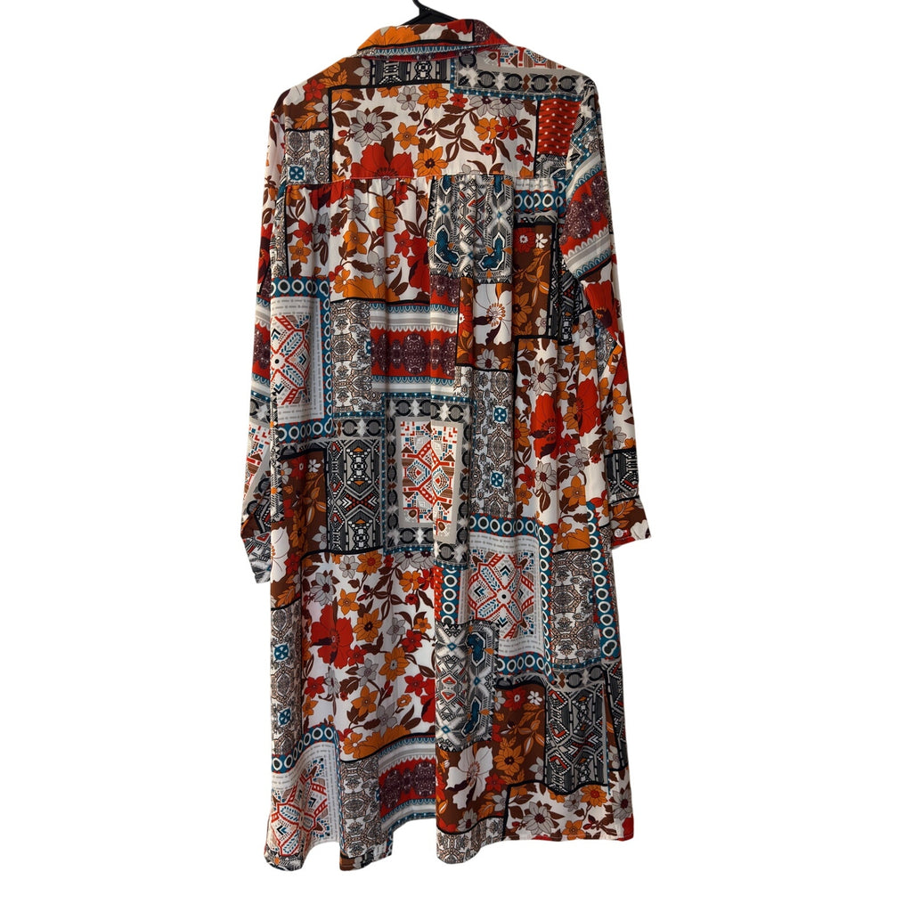 This is a bohemian-style floral geometric orange and tan button-down shirt dress or long cardigan